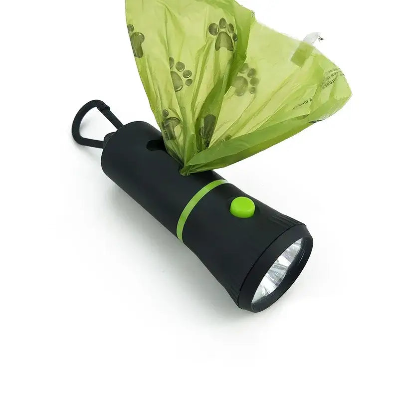 LED poop bag dispenser with green bag, perfect for safe nighttime dog walks.