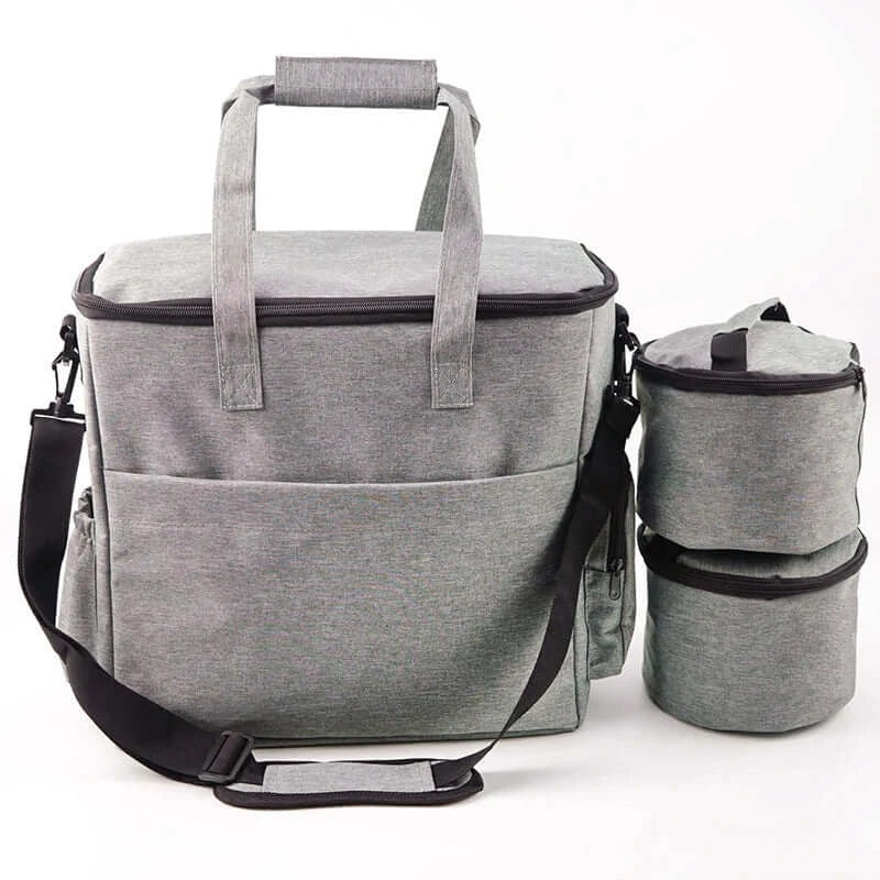 Pet travel bag in gray, waterproof with spacious compartments for organized pet essentials on the go.