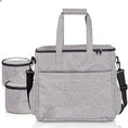 Load image into Gallery viewer, Gray pet travel bag with multiple pockets and detachable containers for organized traveling with pets.