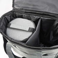 Load image into Gallery viewer, interior view of waterproof pet travel bag with spacious compartments and a round storage container inside
