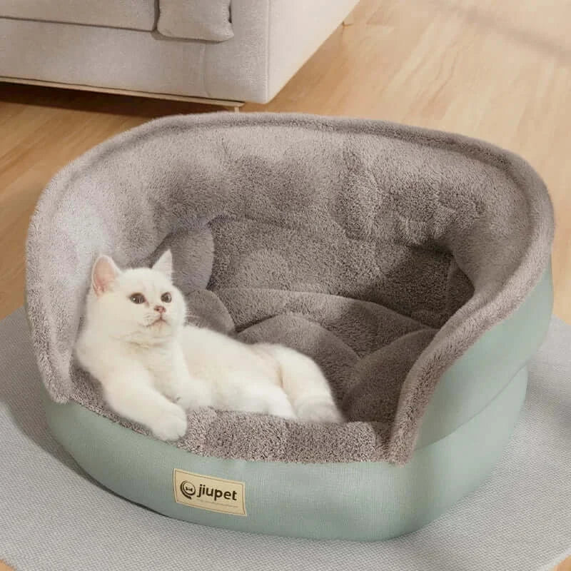 Cozy cat lounging in the Comfort Four Seasons Pet Sofa Bed, designed for ultimate pet comfort and relaxation.