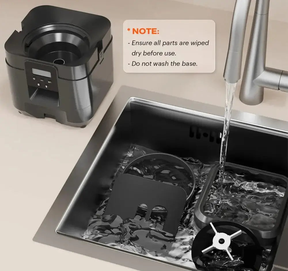 Smart pet feeder components being rinsed in a kitchen sink with water running, highlighting maintenance instructions.