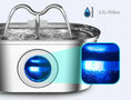 Load image into Gallery viewer, Close-up of the 3.2L stainless steel pet water fountain showcasing its blue light and water flow feature.