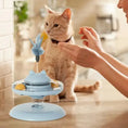 Load image into Gallery viewer, Interactive cat toy with spinning ball and treat dispenser, engaging a playful cat at home.