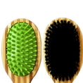 Load image into Gallery viewer, Bamboo double-sided pet grooming brush with a rubber and bristle side for effective grooming and deshedding.
