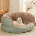 Load image into Gallery viewer, Cozy cat lounging in a plush Comfort Four Seasons Pet Sofa Bed, designed for year-round comfort and style.
